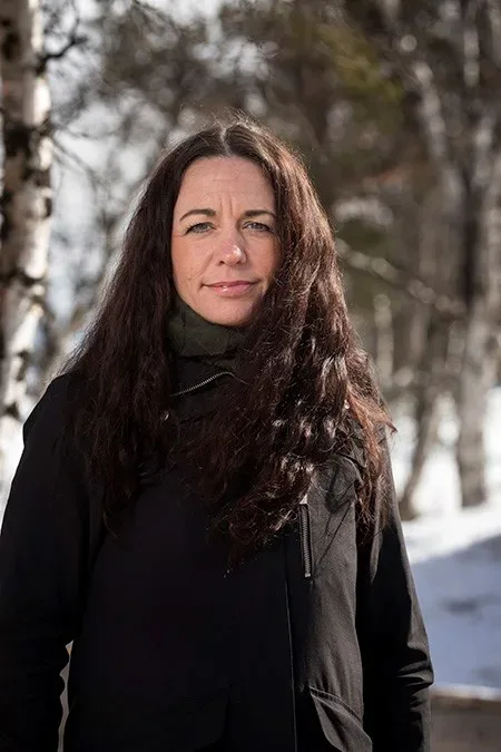 Woman standing in snowy environment