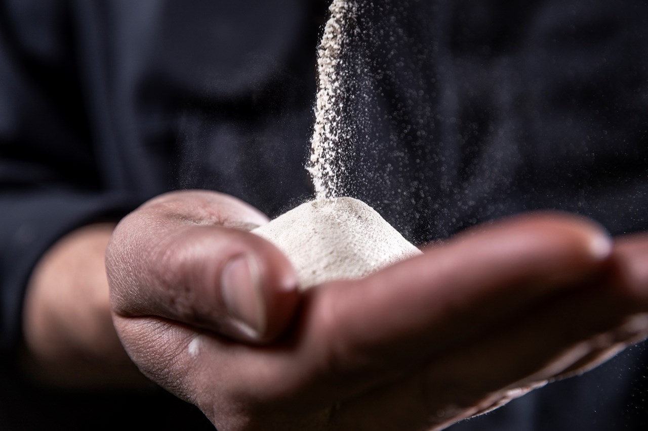 Hand full of a powder-like material