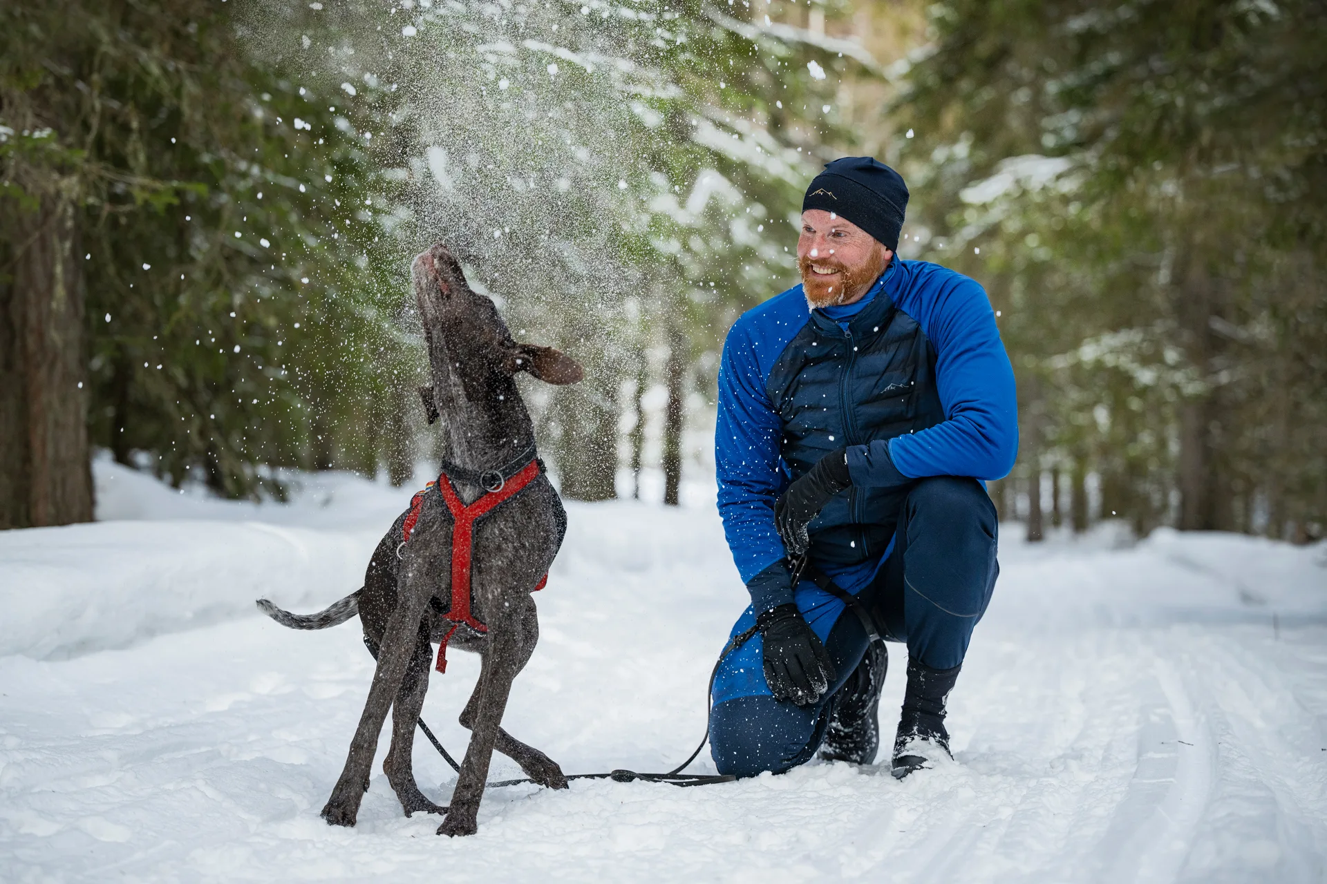 Man and dog outside in winter